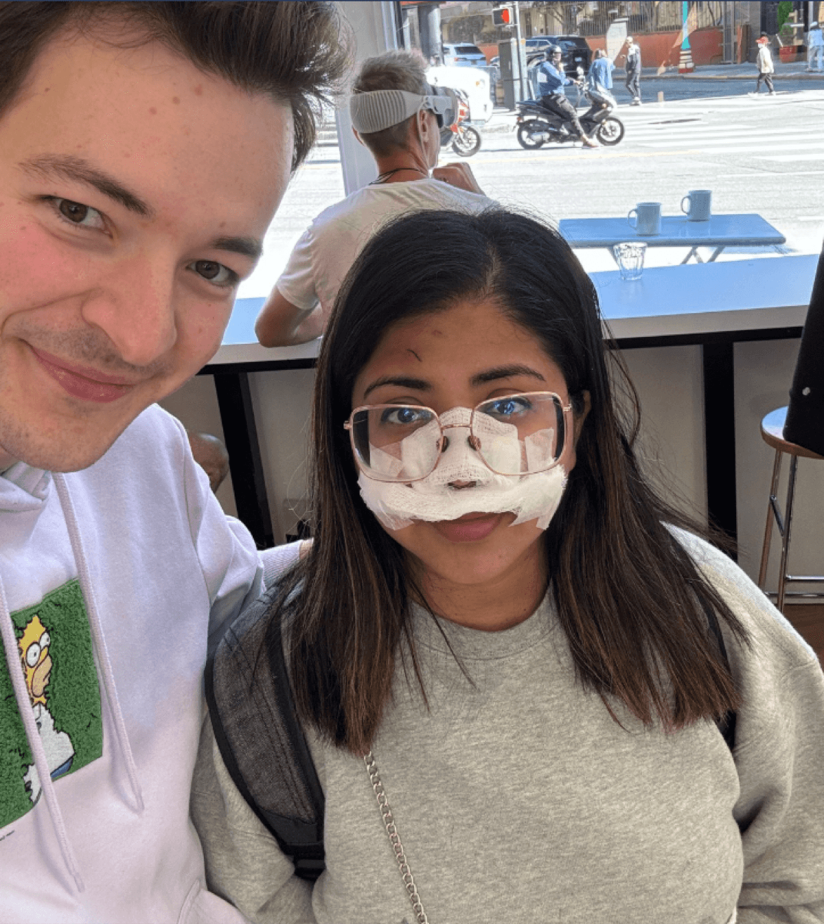 Jack and Faria in a San Francisco café a few days after the accident, Faria with a bandaged nose